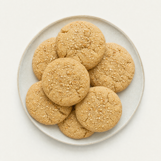 Rahash sesame cookies on a cream plate, overhead