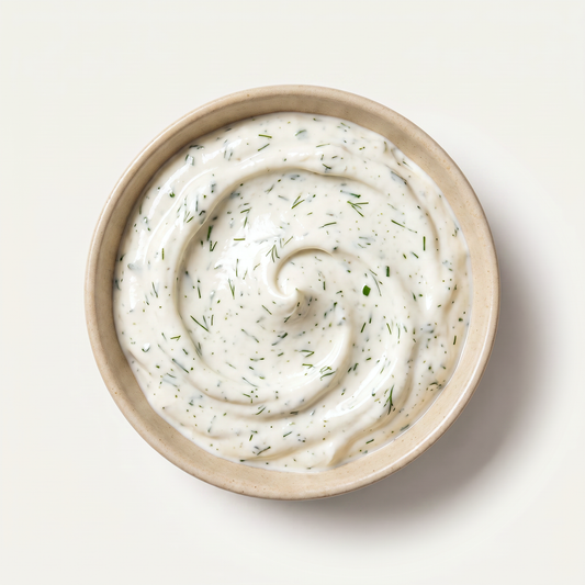 Probiotic vegan ranch dip with herbs in a beige bowl, overhead