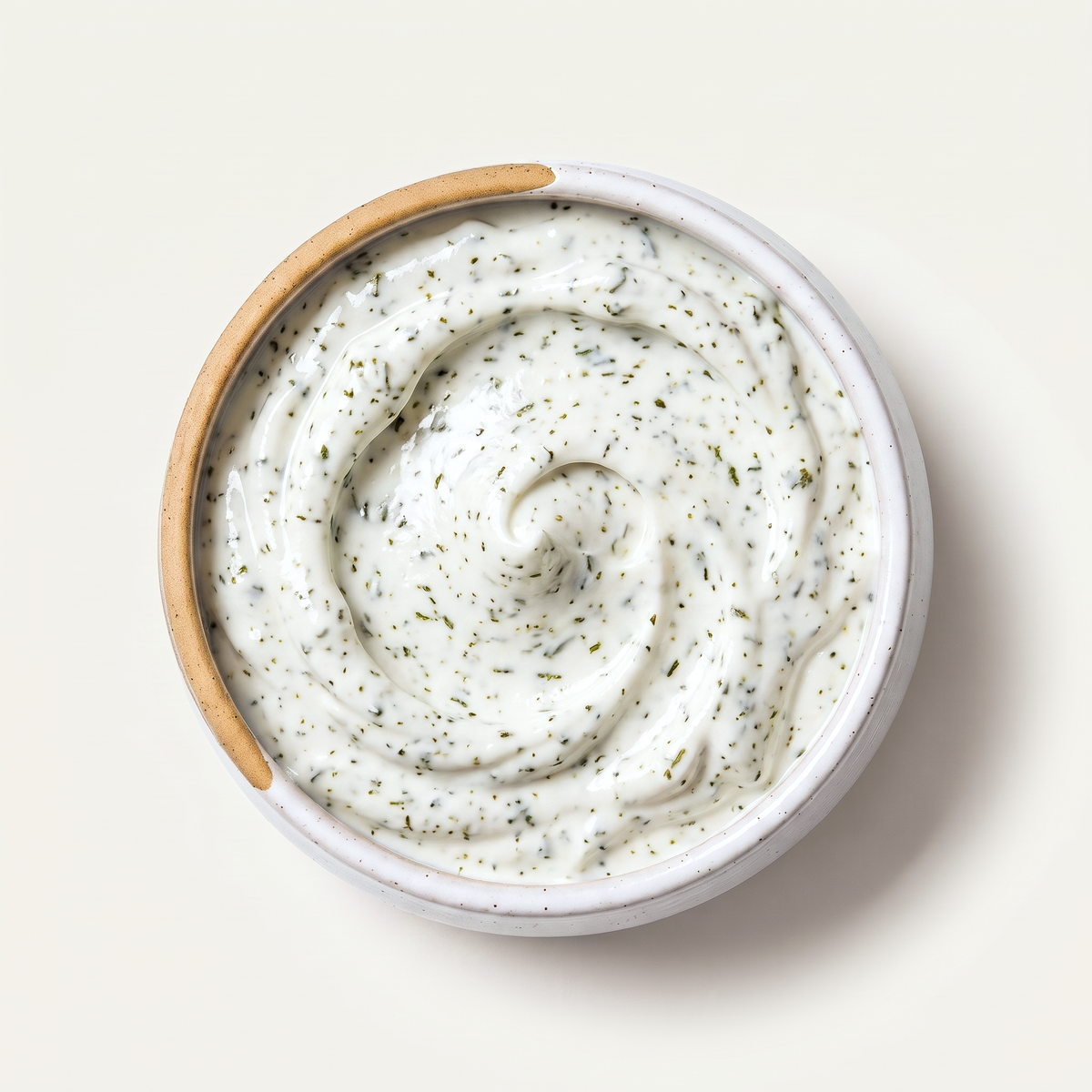 Probiotic za'atar labneh, herbs mixed through, in a stoneware bowl
